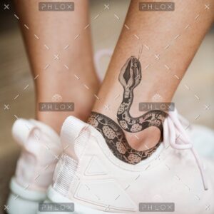 demo-attachment-596-closeup-of-ankle-tattoo-of-a-woman-PJMLBNC1